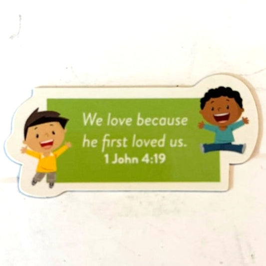1 John 4:19 Scripture Magnet Cartoon Kids Green Banner Christian Children 2.375"