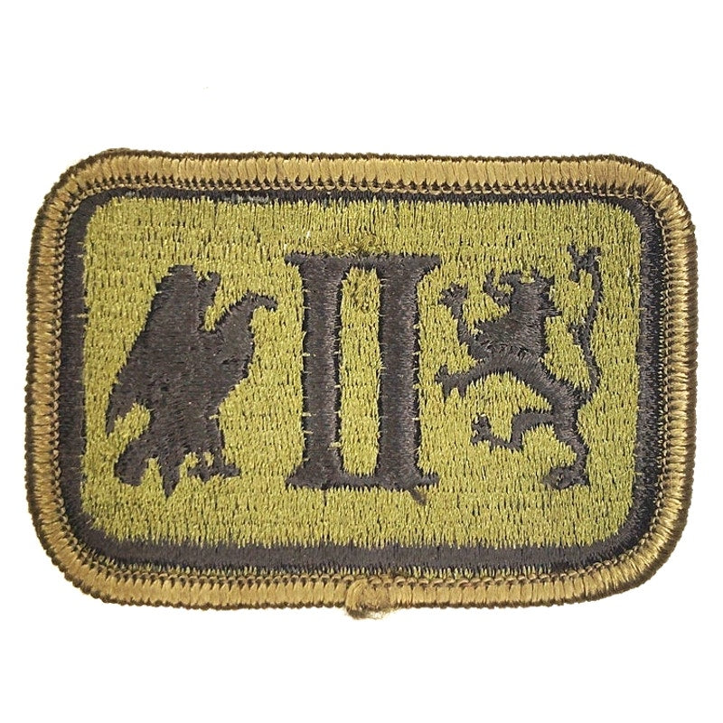 US Army II Corps Subdued Patch Black on ODG Merrowed Edge Sew‑On 3" × 2"
