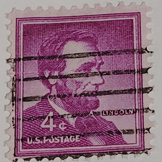 1954 4¢ Abraham Lincoln Stamp – Liberty Series – Scott #1036 – Magenta, Canceled