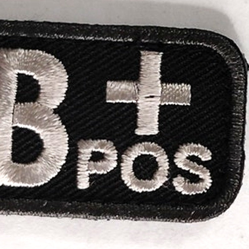 AB+ POS Blood Type Patch White on Black w/ Gray Border 2" × 1" Hook‑Back