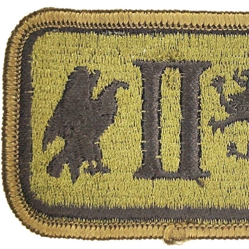 US Army II Corps Subdued Patch Black on ODG Merrowed Edge Sew‑On 3" × 2"