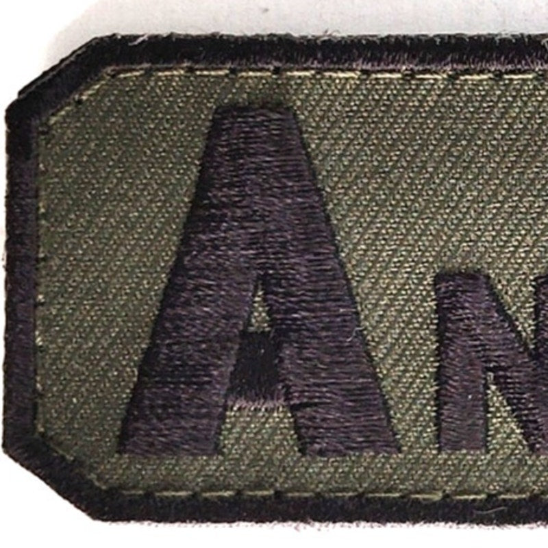 A‑ NEG Blood Type Novelty Patch Subdued Black on Green 2‑1/2" × 1‑1/4" Hook Back