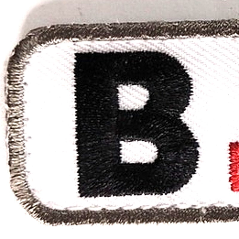 B+ POS Blood Type Patch Black, Red on White w/ Gray Border 2" × 7/8" Hook‑Back
