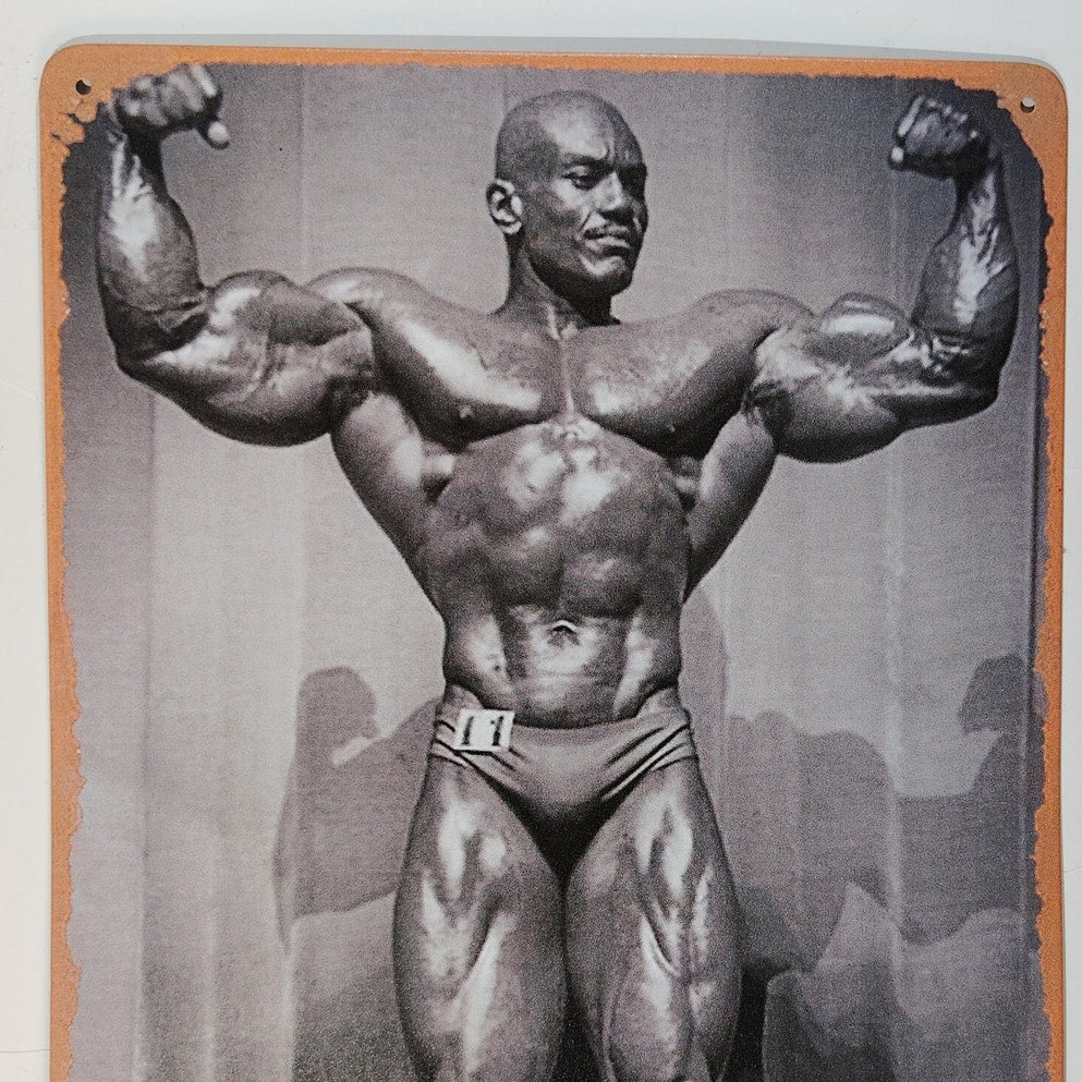 8x12 Tin Sign – Sergio Oliva “The Myth” – Vintage Bodybuilding Icon – Black & White Gym Wall Art
