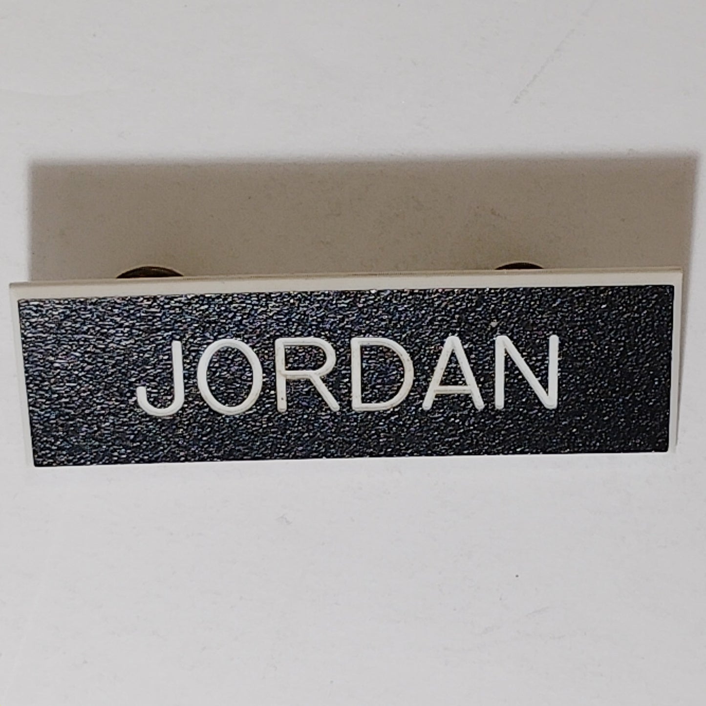 Name Tag “JORDAN”  3" x 1"  Black Plastic – Military Style – Butterfly Pinbacks
